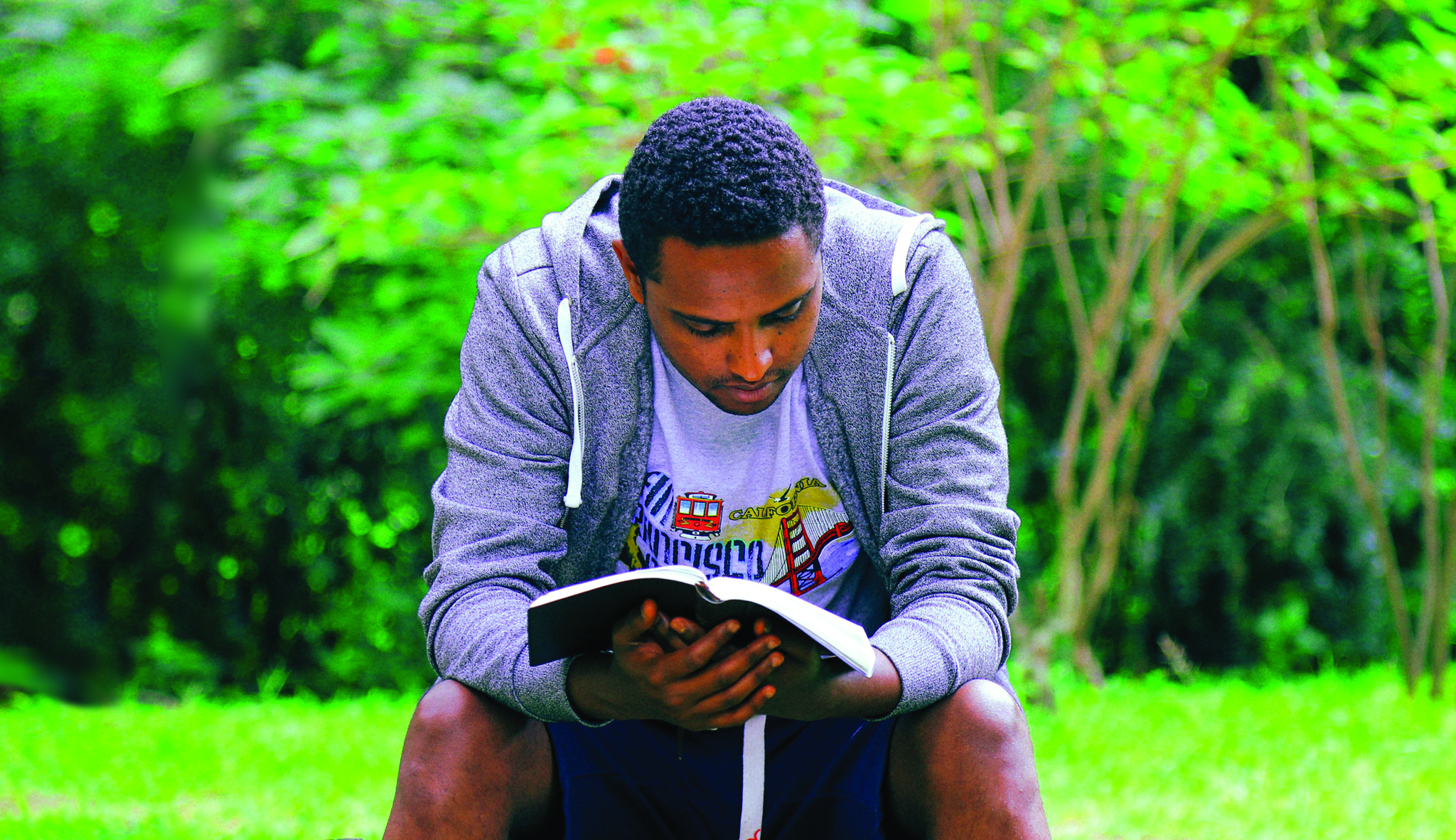 Man sat with bible